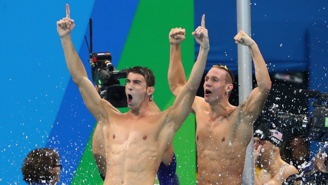 Michael Phelps and Caeleb Dressel celebrate a US victory .jpg